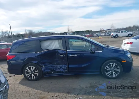 2022 Honda Odyssey Touring z USA, uszkodzony, nr VIN 5FNRL6H8XNB057584